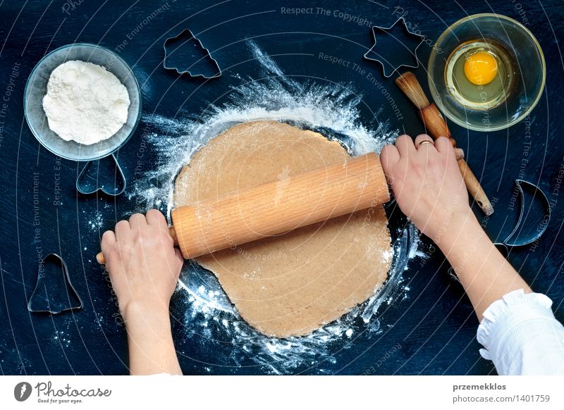 Woman making dough for a Christmas cookies Table Kitchen Human being Girl Adults Hand Make Cut Cutter Knife Egg Flour Gingerbread Home-made knead Preparation