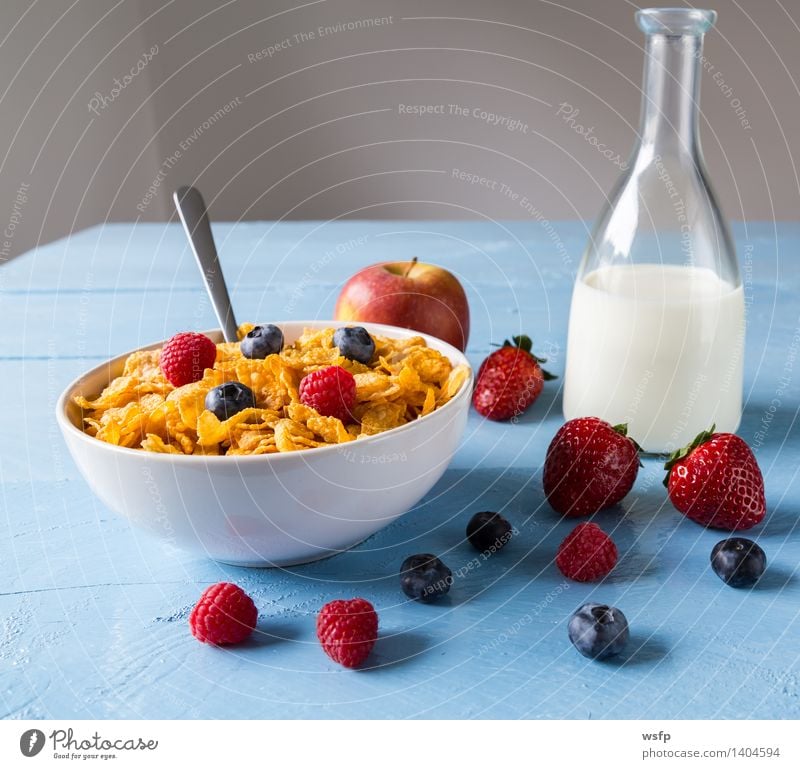 Cornflakes in a bowl Fruit Apple Breakfast Milk Bowl Wood Blue breakfast cereals Flake Blueberry Cereals raspberry Strawberry Grain Eating shell Blue background