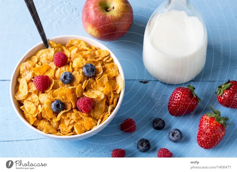 Cornflakes in a bowl Fruit Apple Breakfast Milk Bowl Wood Blue breakfast cereals Flake Blueberry Cereals raspberry Strawberry Grain Eating shell Blue background