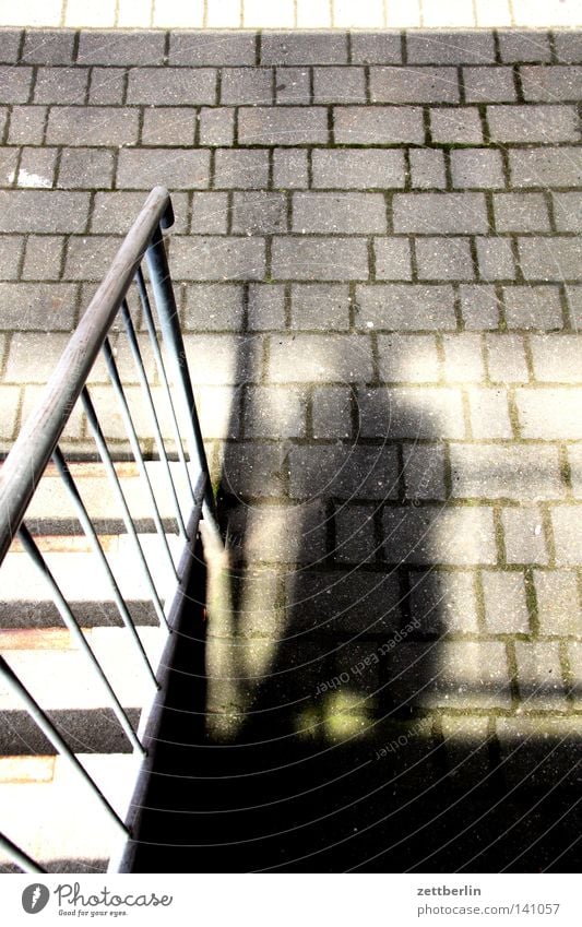 shadow Light Shadow Sun Stairs Banister Landing Approach to the stairs Paving stone Cobbled pathway Courtyard Interior courtyard Backyard Commercial building