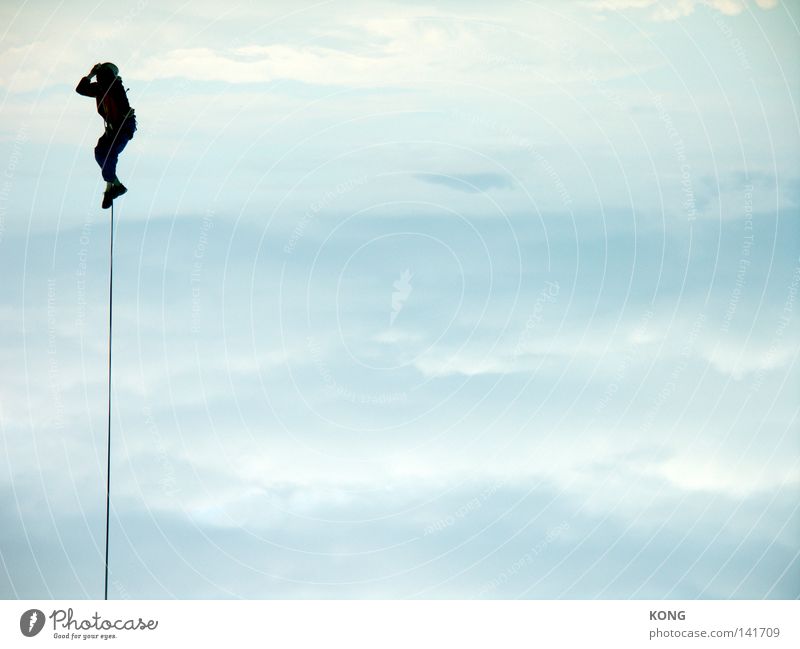 Hangs him high Sky Air Airy Hover Flying Magician Leashed Rope Bind fast Connection To hold on Clouds Mountaineering Tall Upward Above Easy Helium Aloof Release