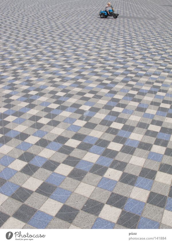 Knokke Drive Playing Infancy 1 Human being Places Playground Toys Blue Gray Tile Floor covering Ground Paving stone Colour photo Exterior shot Abstract Pattern