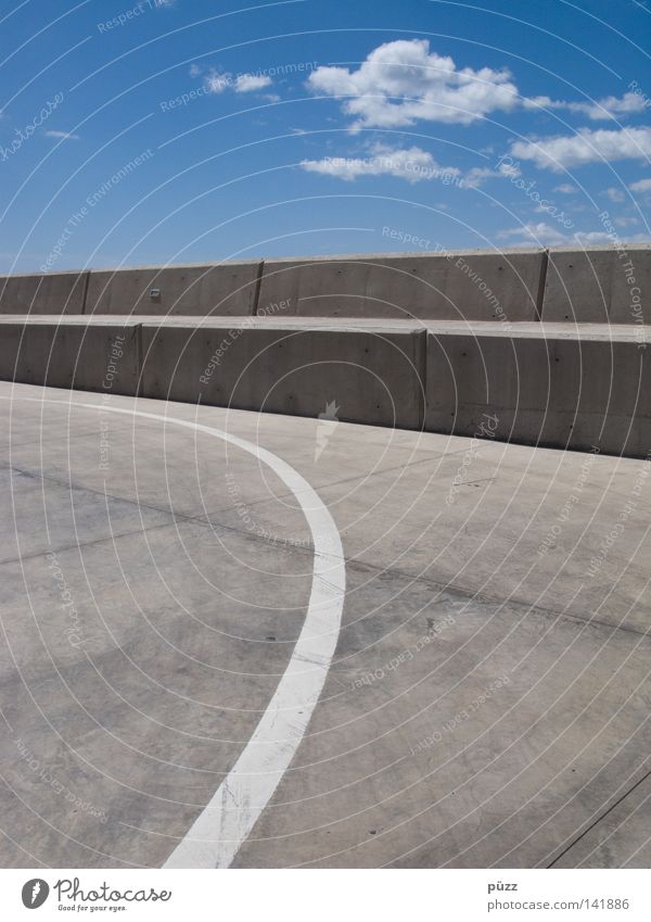 line Sky Clouds Wall (barrier) Wall (building) Traffic infrastructure Street Concrete Signs and labeling Line Blue Gray White Illustration Colour photo