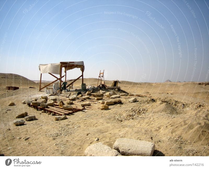 behind the pyramid Desert Sky Sand House (Residential Structure) Hut Stone Living or residing Working man Break Sun sail Weather protection Column Restoration