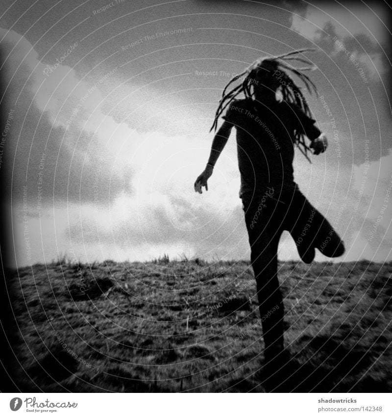 cursed Back-light Dreadlocks Holga Meadow Old Twenties Clouds Gray Black White Walking Going Escape Above Human being Mountain black and white Contrast