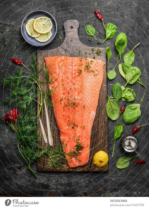 Salmon fillet on rustic chopping board with fresh ingredients Food Fish Vegetable Herbs and spices Nutrition Banquet Organic produce Vegetarian diet Diet Bowl