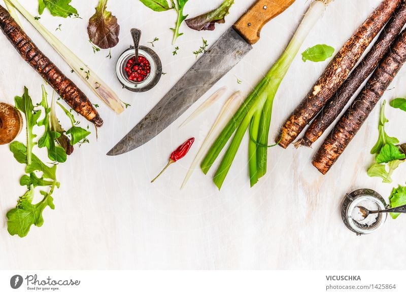 Black salsify and ingredients for cooking with a kitchen knife Food Vegetable Herbs and spices Nutrition Lunch Dinner Organic produce Vegetarian diet Diet Bowl