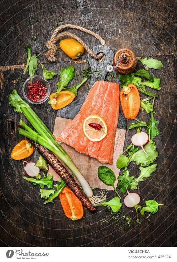 Salmon fish fillets on chopping board with fresh vegetables Food Fish Vegetable Lettuce Salad Herbs and spices Nutrition Lunch Dinner Buffet Brunch Banquet