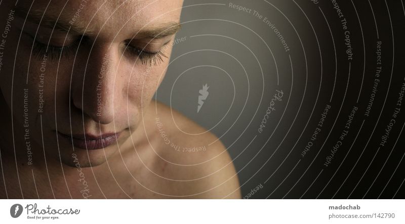 portrait young man eye contact Subdued colour Interior shot Studio shot Copy Space right Upper body Half-profile Downward Looking away Closed eyes Face Calm