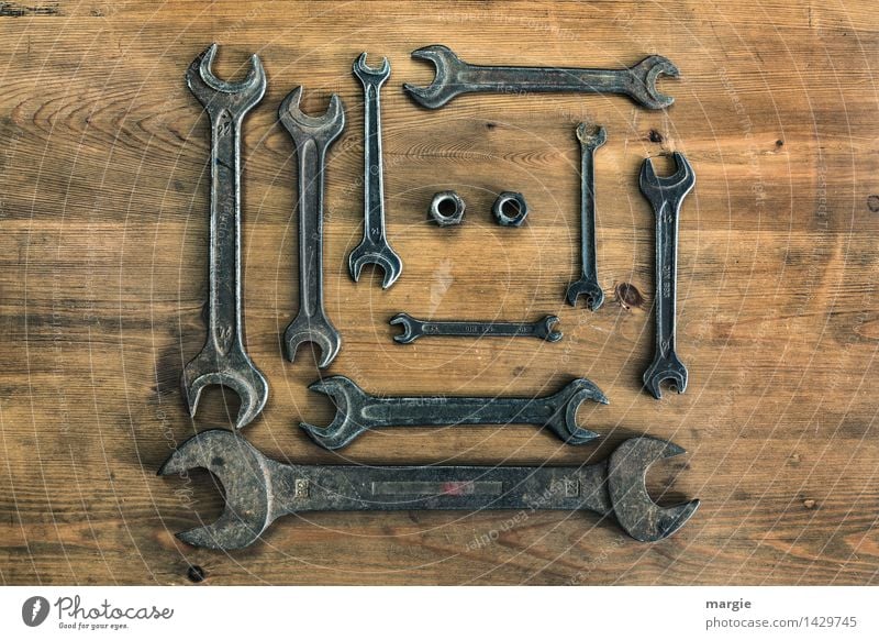 A collection of wrenches in different sizes, two nuts in landscape format Leisure and hobbies Home improvement Work and employment Profession Craftsperson