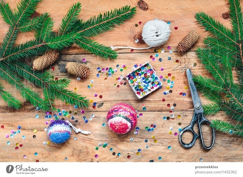 Making Christmas ball pinning the sequins onto the ball Handcrafts Decoration Table Christmas & Advent Scissors Wood Ornament Creativity christmas colorful