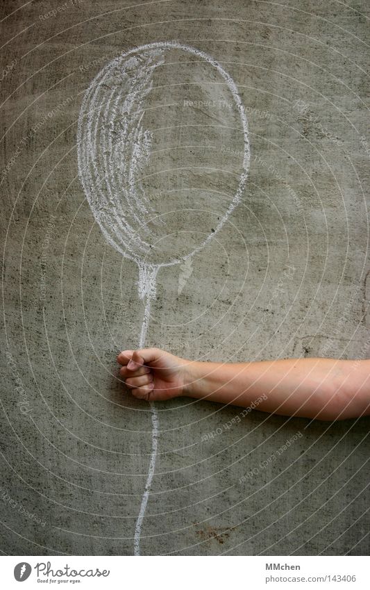 balloon Chalk Wall (building) Concrete Wall (barrier) Earmarked Painting and drawing (object) Arm Grasp To hold on Hand Fingers White Gray Balloon Blow Breath
