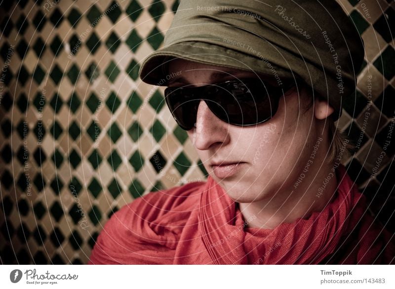 Operation Marrakech Woman Portrait photograph Cap Baseball cap Scarf Neckerchief Sunglasses Eyeglasses Wall (building) Mosaic Near and Middle East Morocco Agent