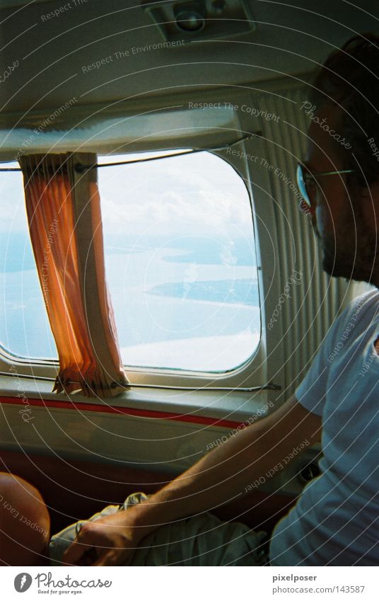Beachcraft to Salvador Airplane Window Drape Ocean T-shirt Orange Bad weather Flying Light aircraft Summer