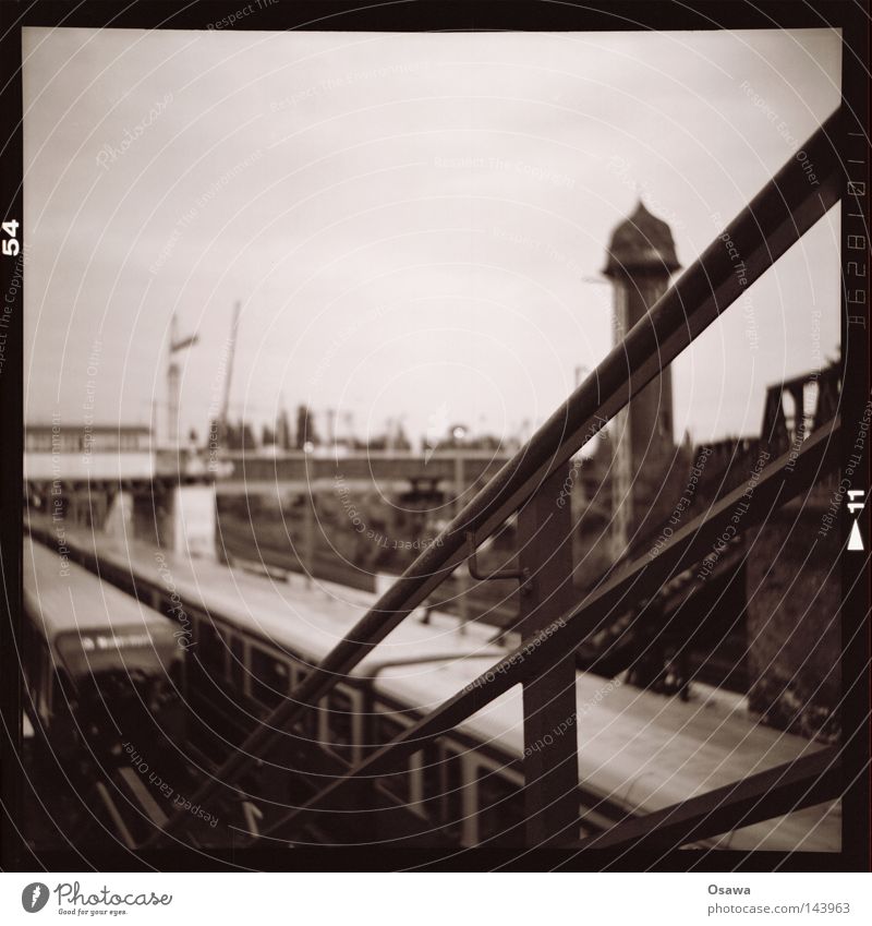 East Cross 14 Lomography Medium format Depth of field Black & white photo Train station Platform Berlin Friedrichshain Evening Old Commuter trains Railroad