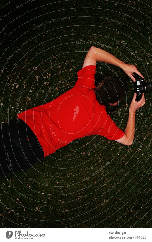 THEY CALLED HIM 'RED MAN'. Guy Fellow Man Masculine Youth (Young adults) Grass Meadow Camera Photographer Take a photo Contrast Green Red Hand Arm Legs