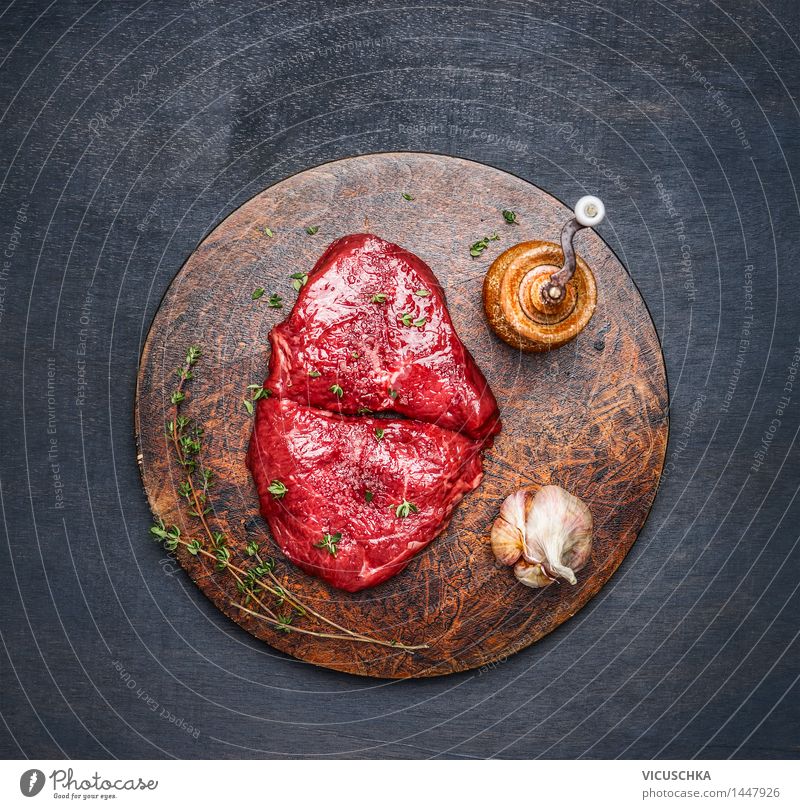 Steaks with ingredients on a round chopping board Food Meat Herbs and spices Nutrition Lunch Dinner Organic produce Diet Healthy Eating Table Kitchen Design