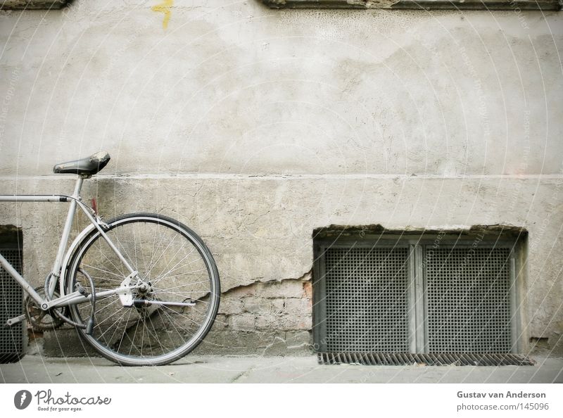 stand wheel Bicycle Wall (building) Window Cellar Cellar window Grating Plaster Facade Iron Framework Photography Backyard Things Seating Partially visible