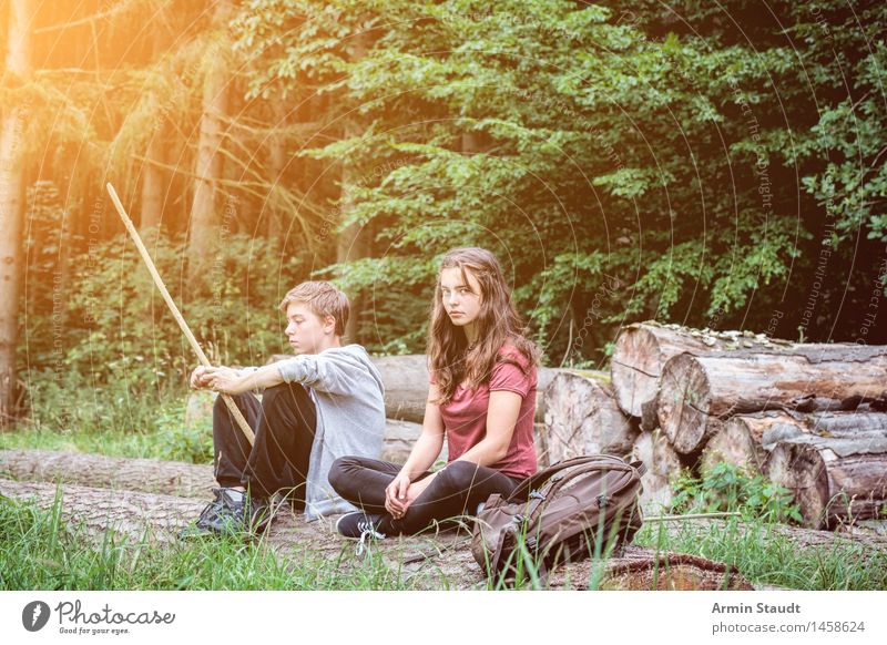 siblings sit in the woods having a break in a bad mood Lifestyle Relaxation Calm Summer Masculine Feminine Young woman Youth (Young adults) Young man Woman
