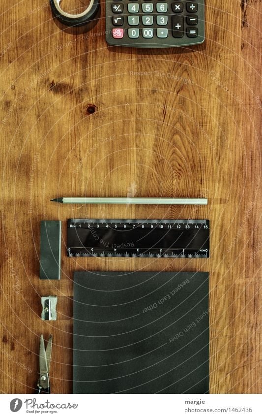 Portrait format: black writing utensils, paper, notes, scissors, pencil, ruler, adhesive tape, eraser, calculator on a wooden desk Education Study