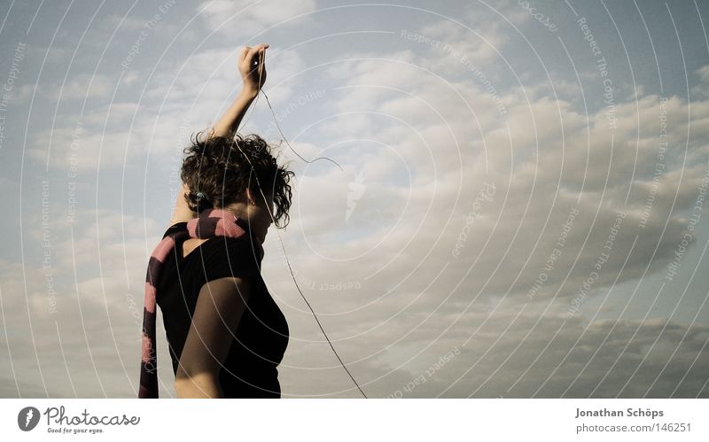 young woman in black and scarf in front of cloudy sky with string Contentment Calm Rope Human being Feminine Young woman Youth (Young adults) Back 1