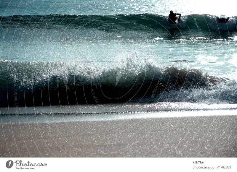 sprayed Waves Water Sand Beach White crest Surfer Sun Drops of water Reflection Ocean