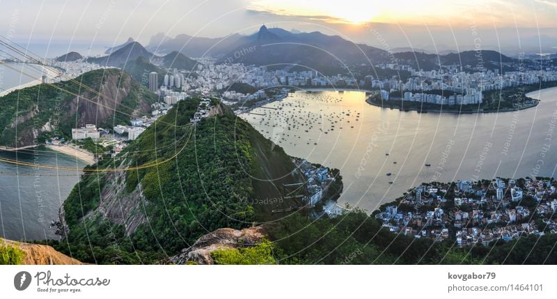 Panoramic view of Rio de Janeiro at sunset, Brazil Beautiful Vacation & Travel Beach Ocean Landscape Town Skyline Aircraft Sunset Vantage point america christ