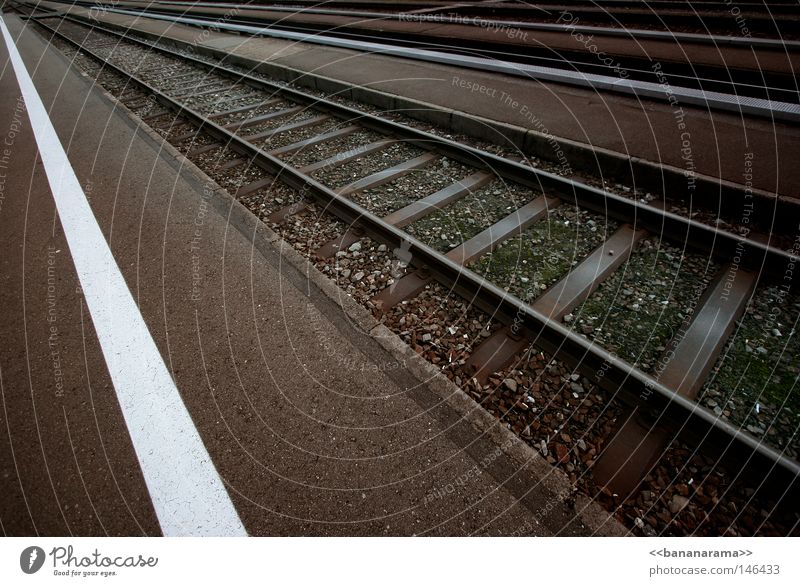 on the run Railroad Commuter trains Railroad tracks Vanishing point Far-off places Infinity Driving Transport Vacation & Travel Switzerland Gravel