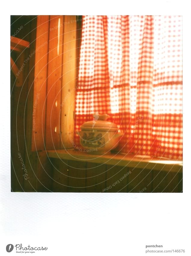 Bavarian Weißwursttopf stands on a windowsill in front of a red and white curtain. Kitsch, tradition, customs Polaroid Light Nutrition Bowl Pot Sun