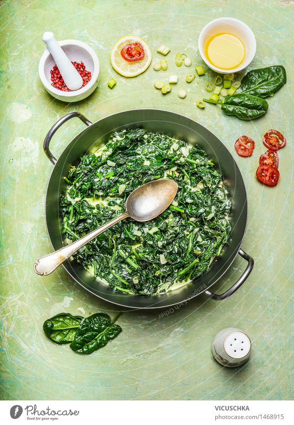 Spinach in cream sauce in a saucepan with spoon Food Vegetable Herbs and spices Cooking oil Nutrition Lunch Dinner Organic produce Vegetarian diet Diet