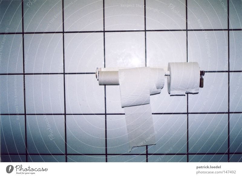 Stop toilet paper theft on public toilets Toilet Toilet paper Coil Tile Cardboard Castle Padlock Closed Store premises Gloomy White Paper Round Sharp-edged