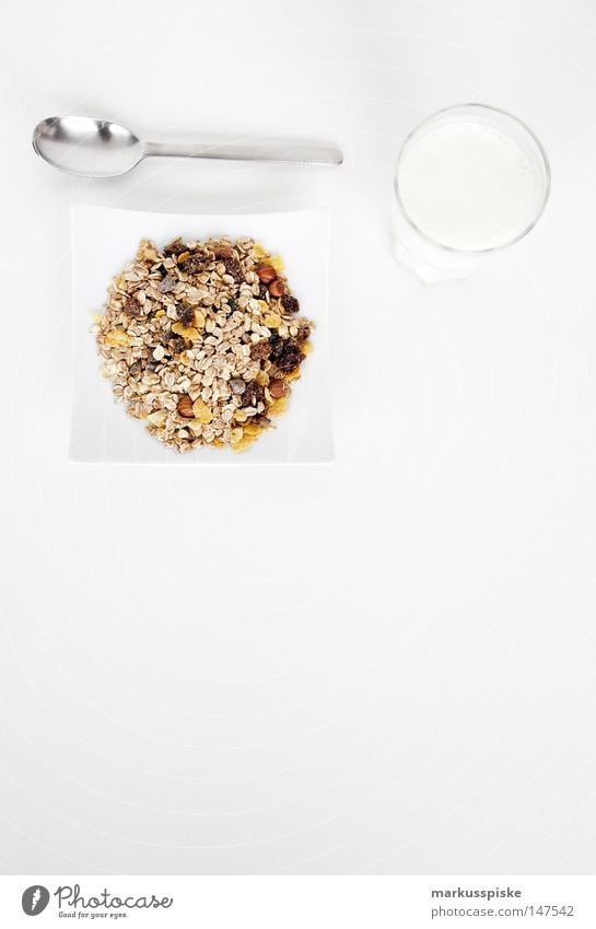 müsli with milk Breakfast Beverage Spoon Milk Plate Healthy Nutrition Grain Raisins Oat flakes Wheat Rye Oats Hazelnut Raw vegetables Whole foods