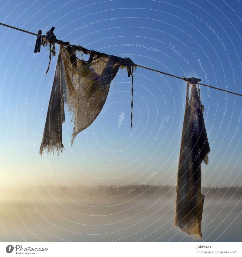 left hanging Laundry Clothesline 2008 Nova Scotia Canada Hang Fog Morning Clothes peg Floor cloth Old Rope Sky Blue White Brown Square Derelict Jute Sack Forget