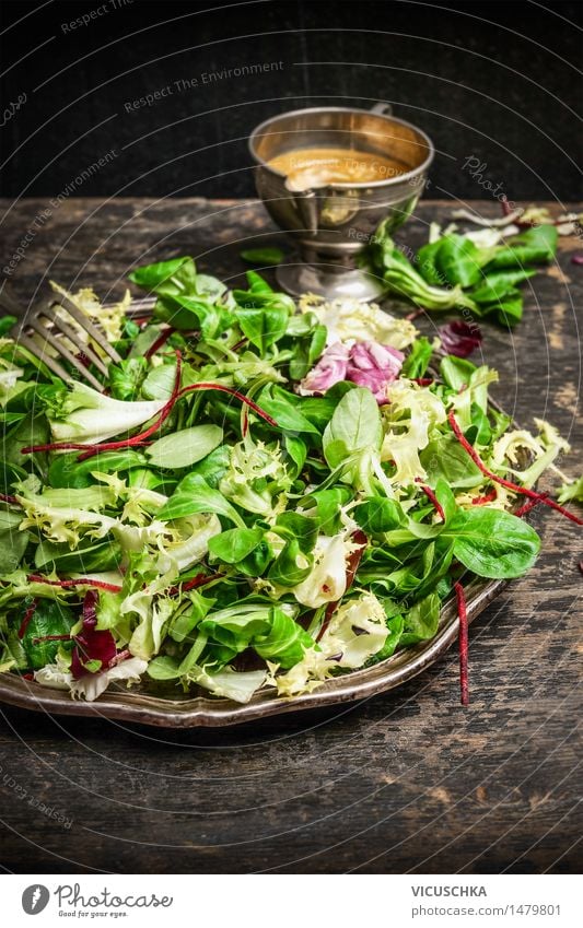 Healthy green salad with dressing on dark background Food Lettuce Salad Nutrition Lunch Organic produce Vegetarian diet Diet Italian Food Plate Style Design