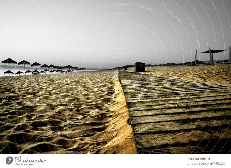 picnic Beach Ocean Sky Wood flour Footbridge Horizon Gloomy Loneliness Stone Black Yellow Gray Relaxation Portugal Alentejo Grief Distress Coast Earth Sand