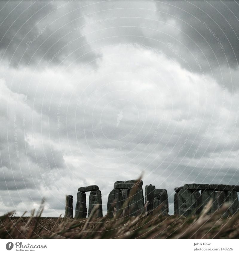Stonehenge I Colour photo Exterior shot Deserted Copy Space top Art Culture Nature Sky Clouds Storm clouds Wind Gale Thunder and lightning Grass Landmark