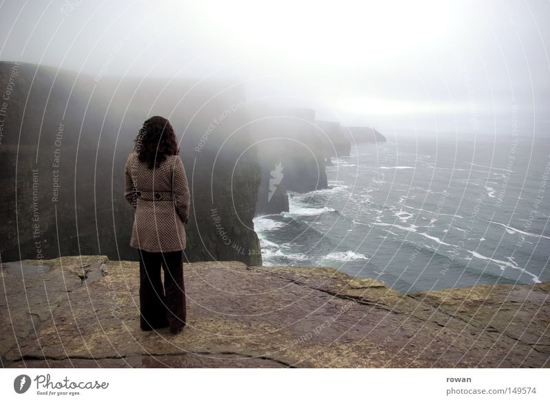 coastguard Colour photo Subdued colour Copy Space top Day Far-off places Beach Ocean Clouds Fog Rock Coast Think Dark Tall Wanderlust Calm Cliff Ireland