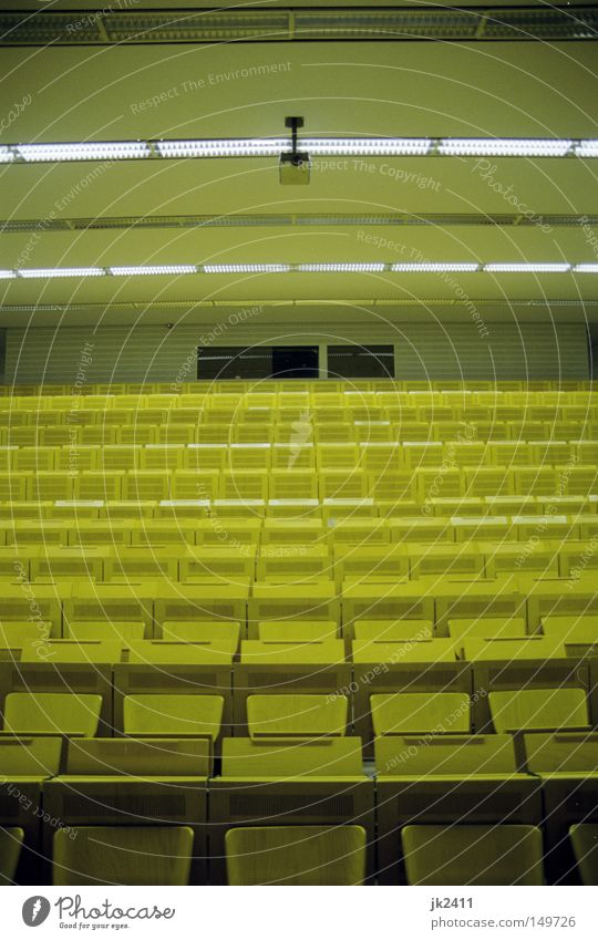 comfortable studying 1 Education Academic studies Lecture hall Yellow Symmetry Seating Data projector Derelict tuition fees Retro Empty Loneliness