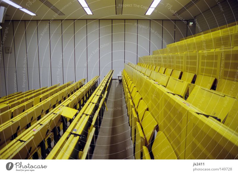 comfortable studying 2 Education Academic studies Lecture hall Yellow Symmetry Seating Data projector Derelict Retro tuition fees Empty Loneliness
