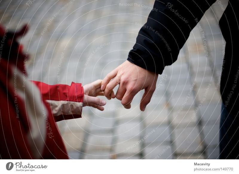 Do not let go Trust Friendship Child Man Woman Relationship Hand Fingers Grasp Cobblestones Anorak Release Touch Connection Red Gray Small Jacket Cold Winter