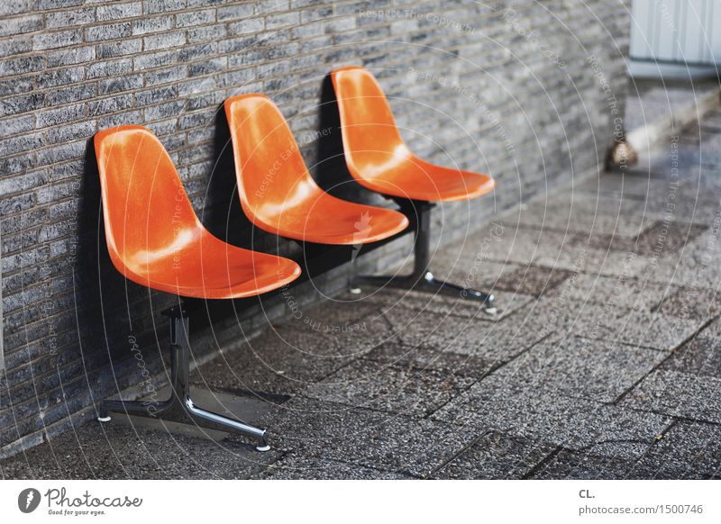 lounge Design Furniture Chair Wall (barrier) Wall (building) Seating Lounges Row of seats Sit Orange Contact Boredom Break Colour photo Exterior shot Deserted