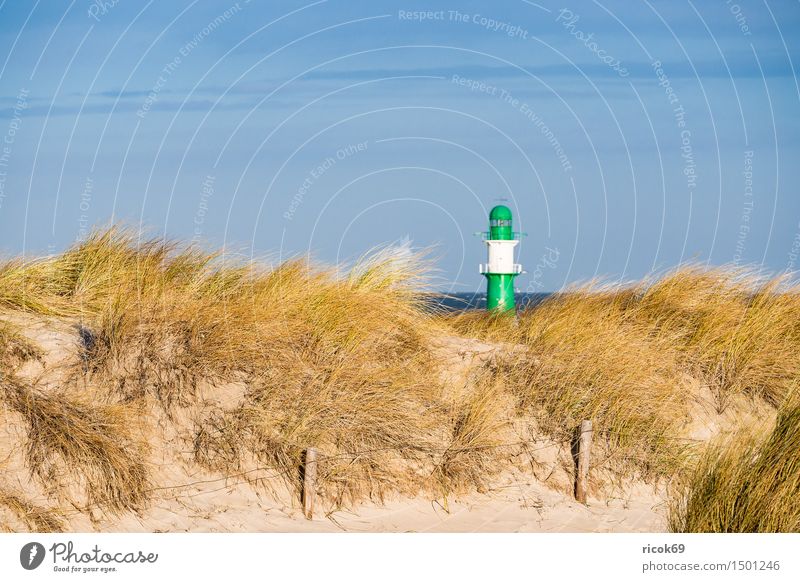 Dune in Warnemünde at the Baltic Sea coast Vacation & Travel Beach Ocean Nature Landscape Clouds Wind Gale Coast Lighthouse Blue Yellow Green Tourism pier light
