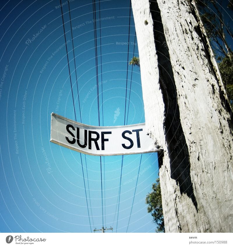 Surf Street Surfing Street sign Electricity pylon Tree Signage Signs and labeling Sky Diagonal Broken Aquatics Summer Signpost. sports