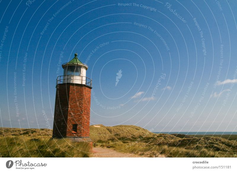 lighthouse North Sea Sylt Lighthouse Tower Brick Beach dune Dune Ocean Warn Navigation Watercraft Captain Sand Landmark Monument Communicate Warning label