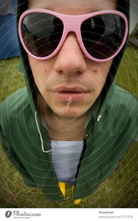 through the pink glasses Raincoat Rubber boots Face Man Sunglasses Cool (slang) Youth (Young adults) Wide angle Mouth Easygoing Fisheye Crazy Nose Head