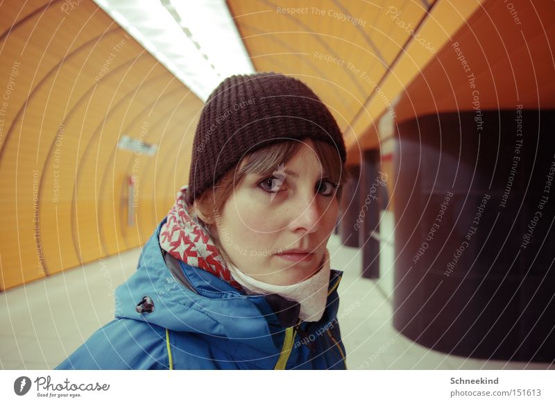 subsoil Underground Subsoil Woman Munich To go for a walk Loneliness Face Railroad Orange Marienplatz