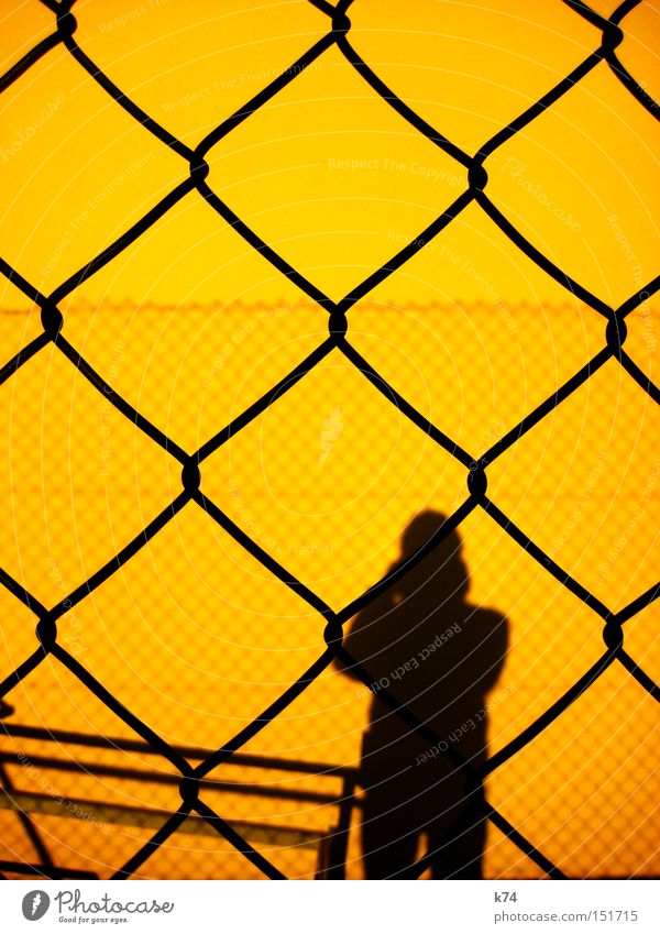 barrier Barrier Hurdle Shadow Human being Man Fence Silhouette Captured Guantanamo Private Border Yellow Penitentiary Fear Panic