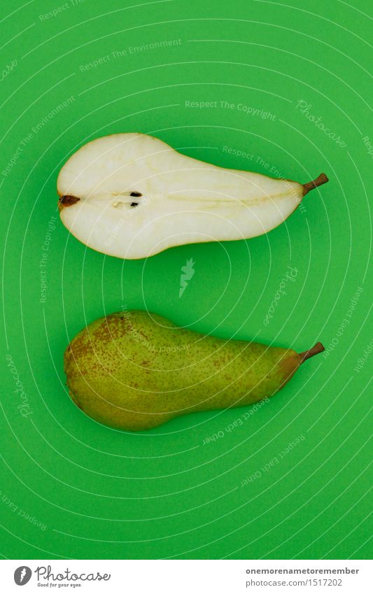 Jammy pear halves on green Art Work of art Esthetic Pear Electric bulb Pear stalk Green Half Healthy Eating Delicious Appetite Vitamin-rich Snack Snackbar