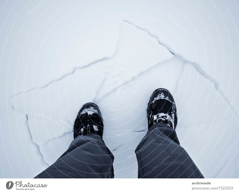 Man walking on broken ice Lifestyle Winter Snow Mountain Hiking Adults Feet Fear Dangerous leg hiker edge Frozen cold Conceptual design danger warning