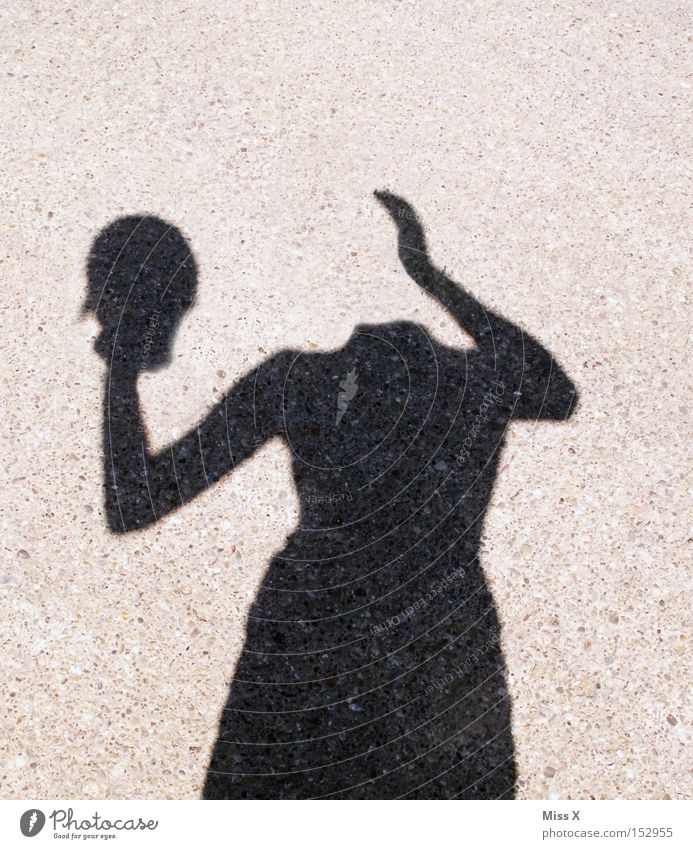 headless Colour photo Black & white photo Exterior shot Shadow Silhouette Woman Adults Head Hand Street Lanes & trails Crazy Whimsical Shadow play Headless